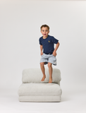 Boy jumping on Rylee Recliner