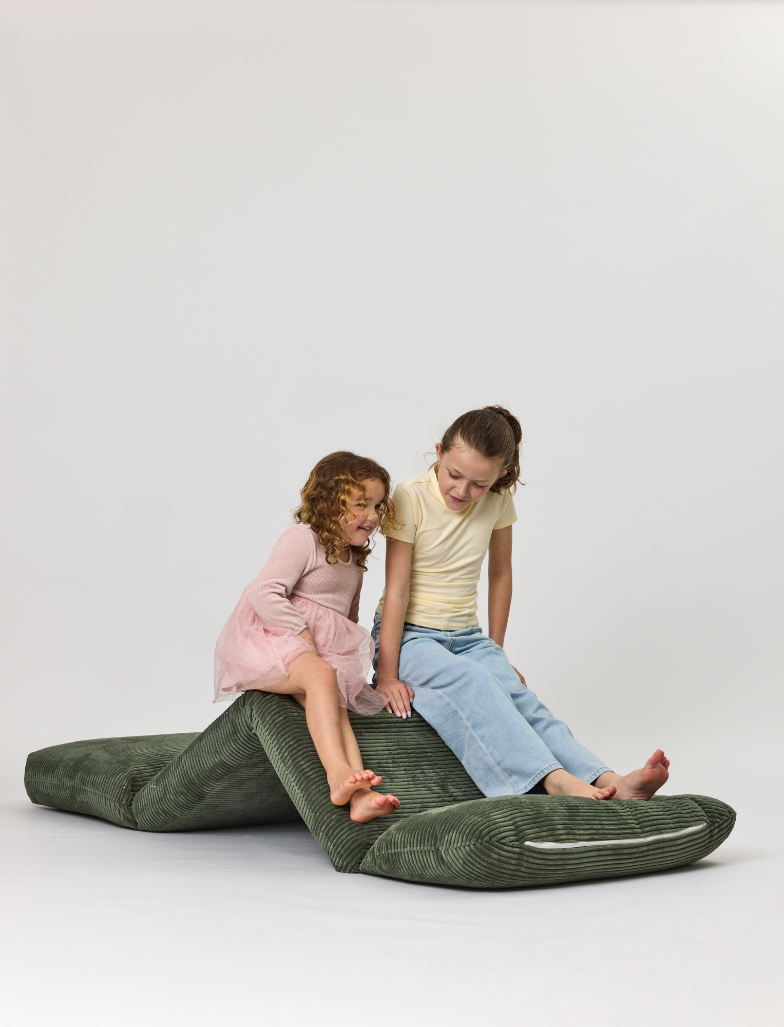 Rylee Recliner in Green with girls on a white background
