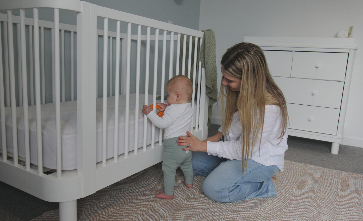 Mother and Baby playing with Florence Cot