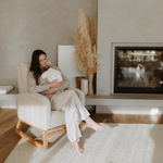 Mother with her little one in a Myla Nursing Chair in a living room