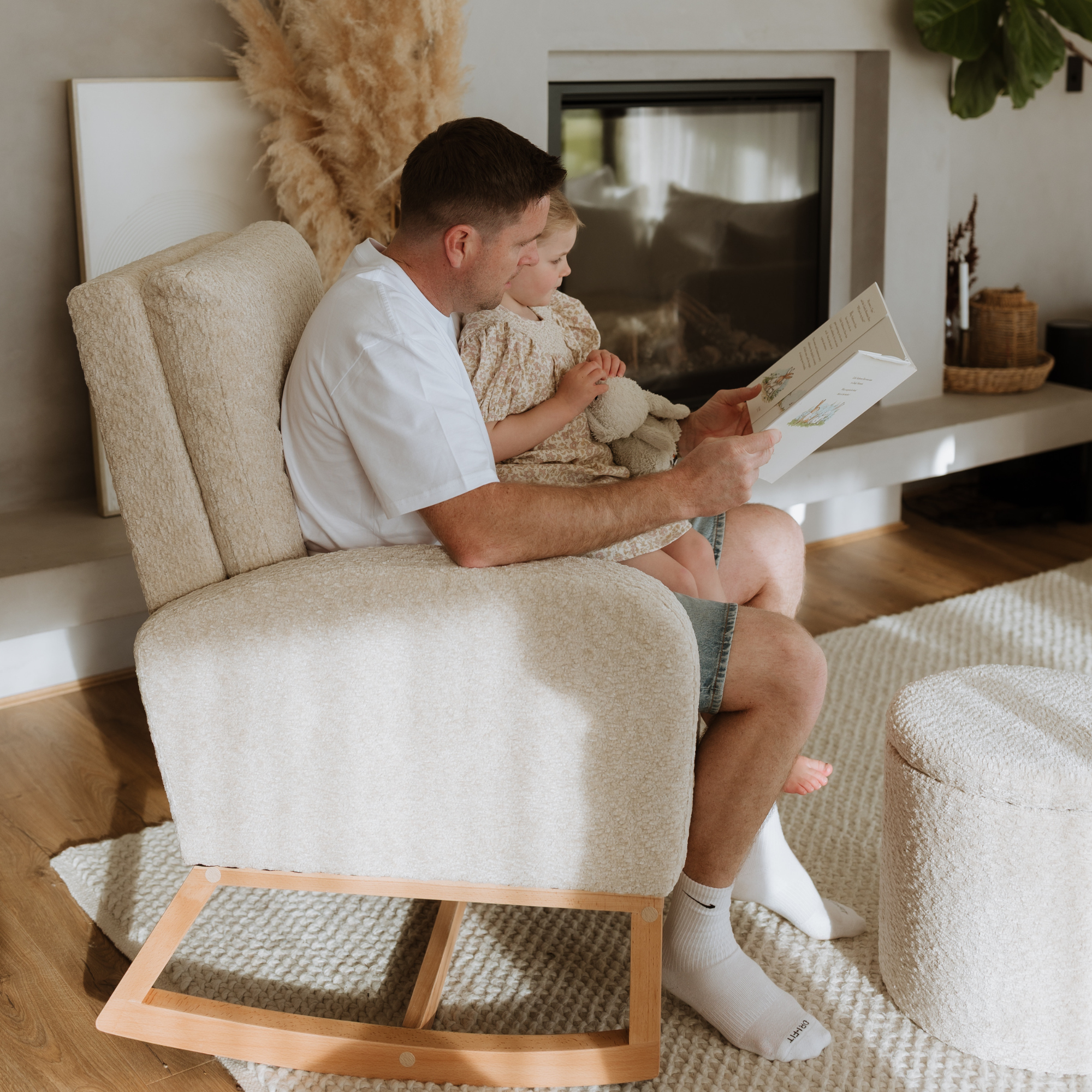 Father and daugher in a Myla Rocking Chair