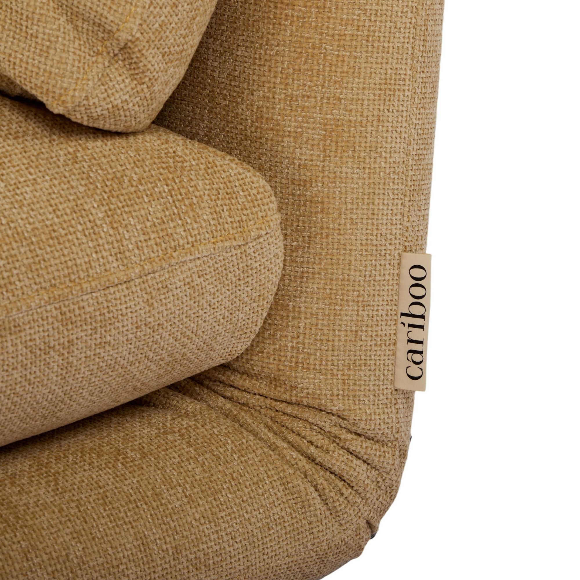 Close-up of a brown textured product with 'cariboo' branding.