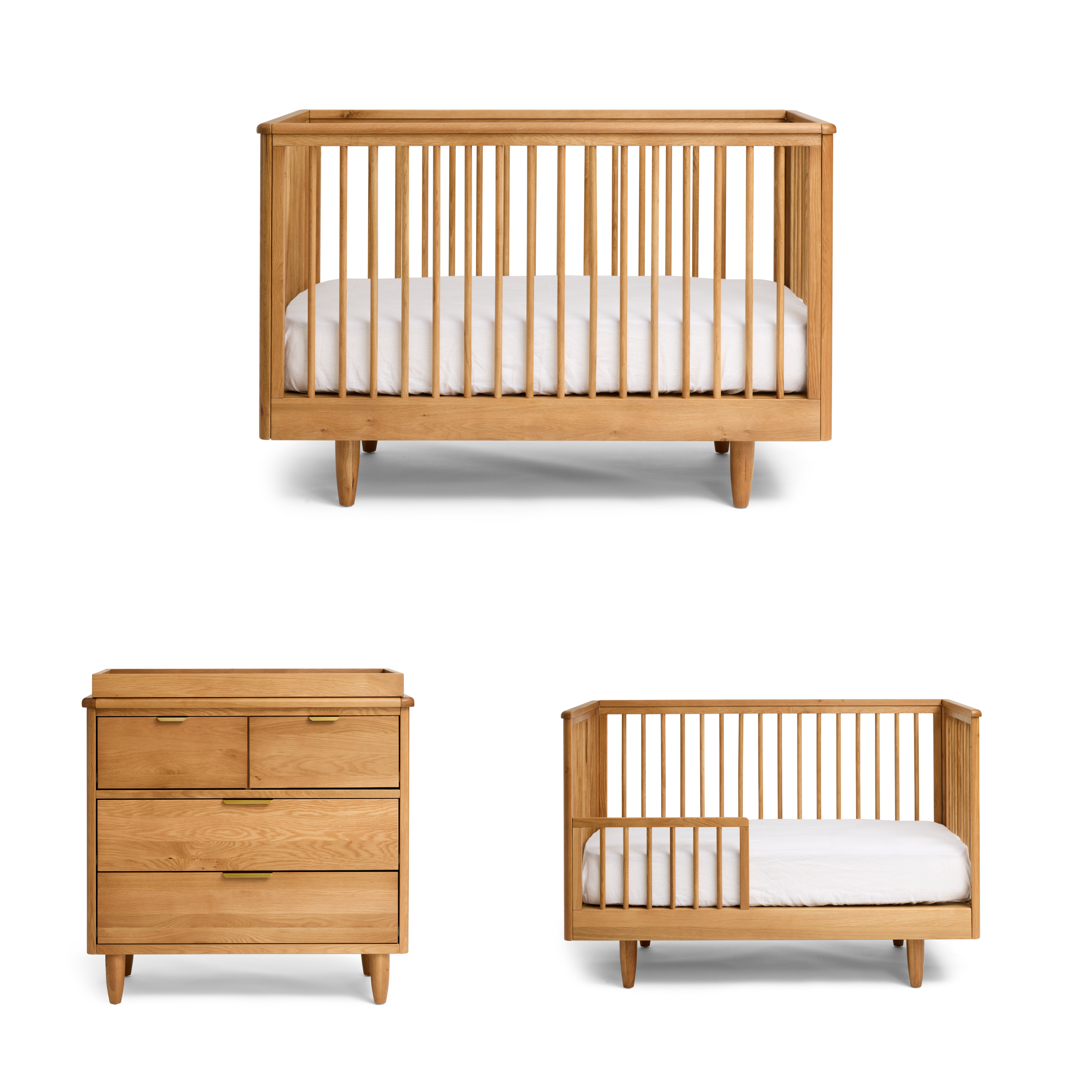 George wooden cot, George dresser, and another crib with white bedding on a white background